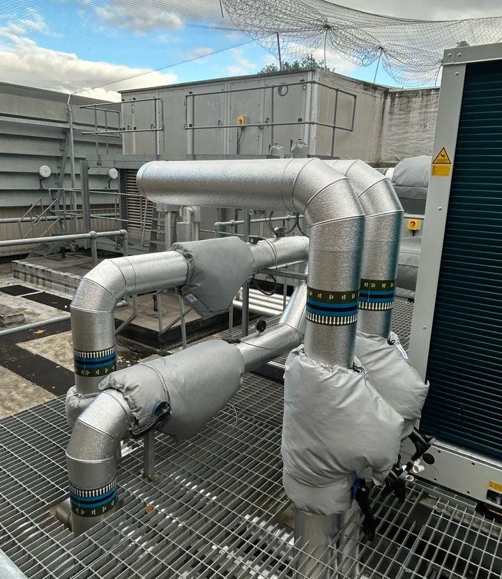 Completed chilled-service installation with insulated fittings and removable jackets