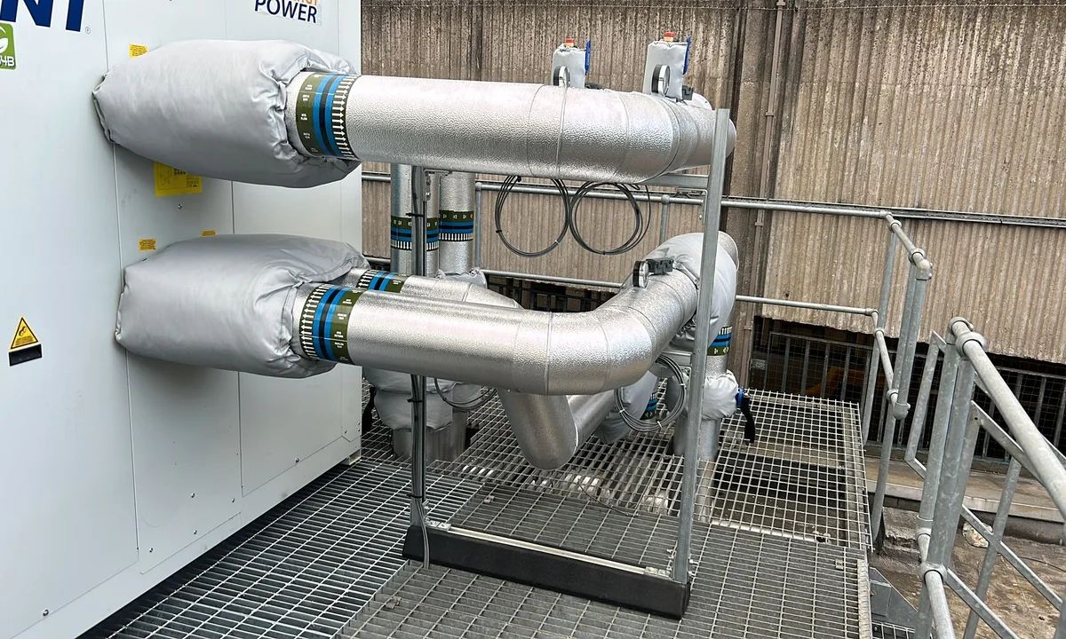 Finished chilled pipework installation with protected valves, flanges and service identification
