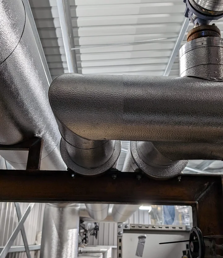 Weather-resistant aluminium cladding fitted to external commercial pipework