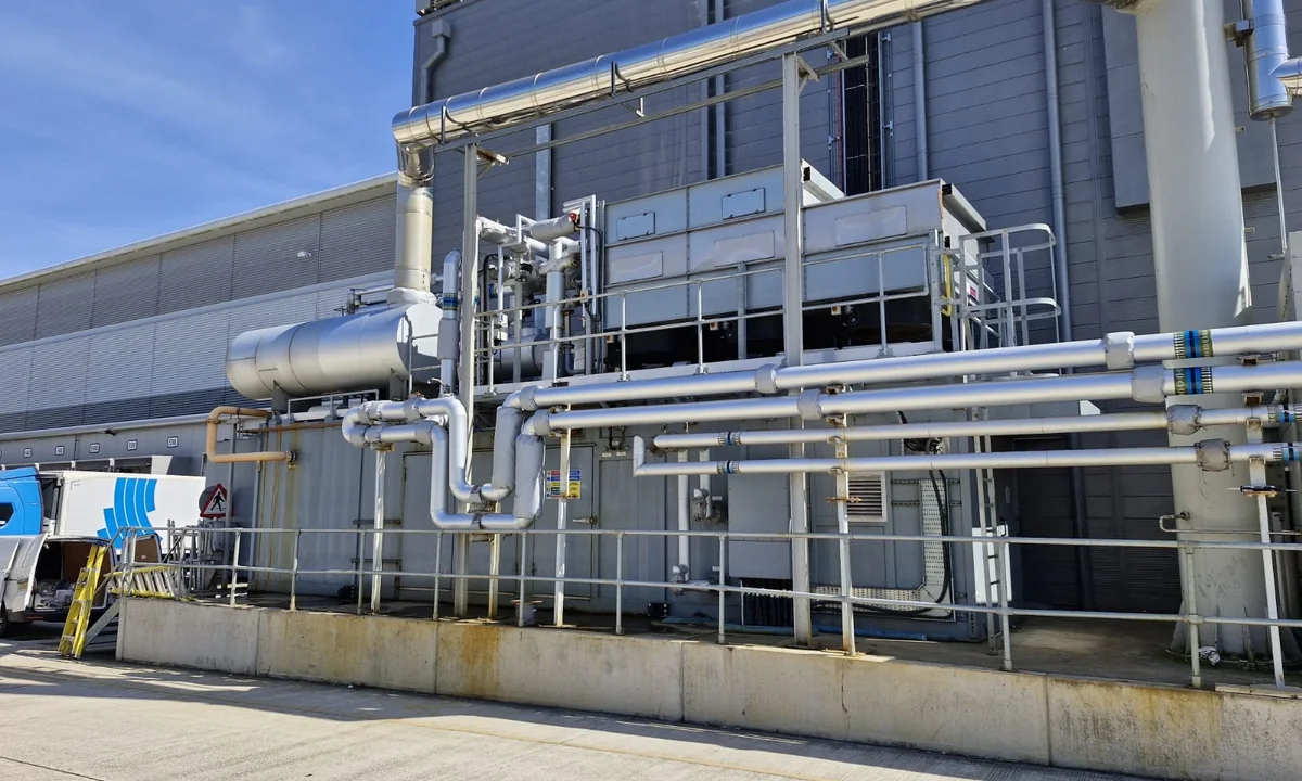 Aluminium-clad pipework installed across an external commercial plant area
