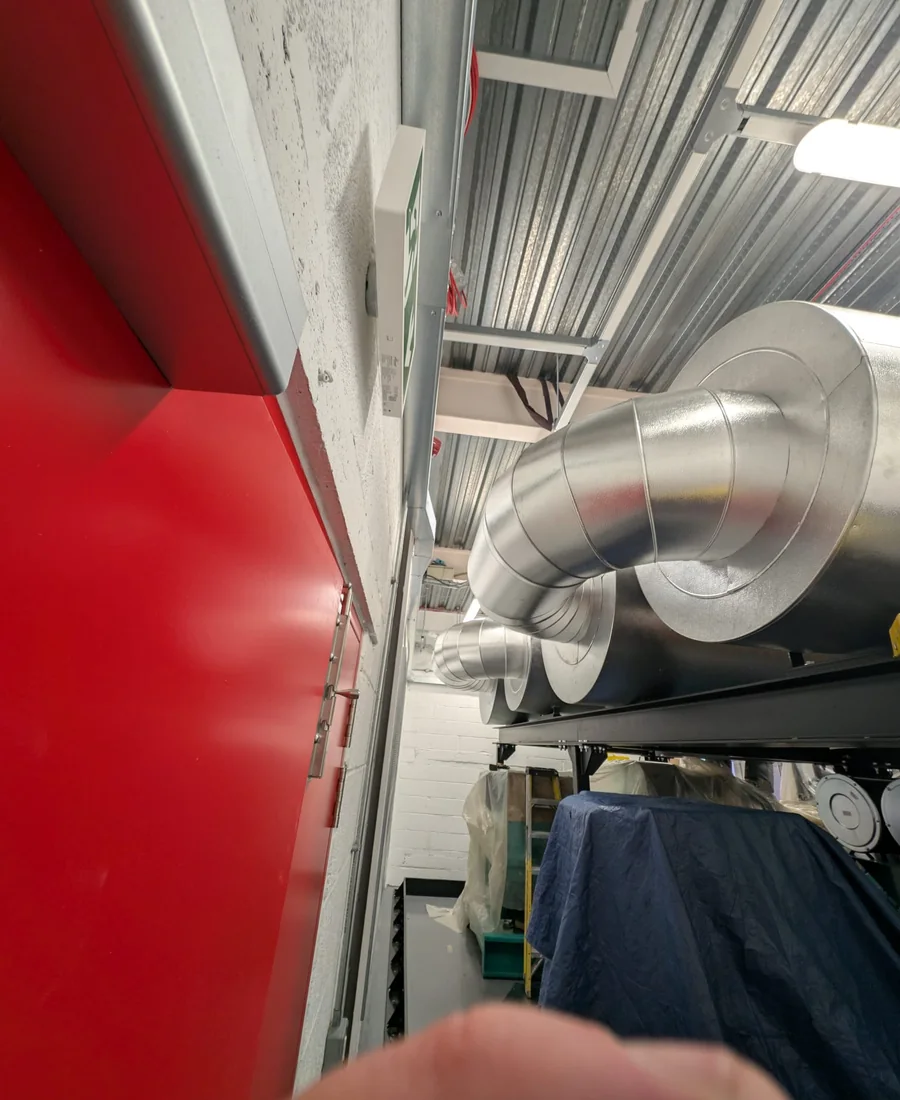 Finished metal-clad services in an occupied commercial building