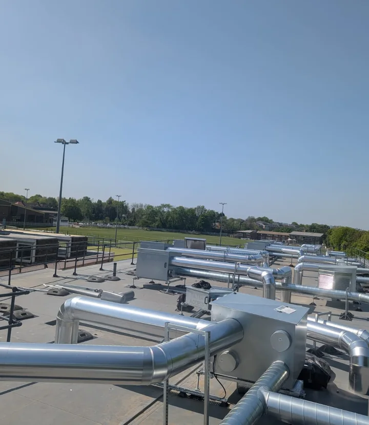 Completed education rooftop insulation protected from weather exposure