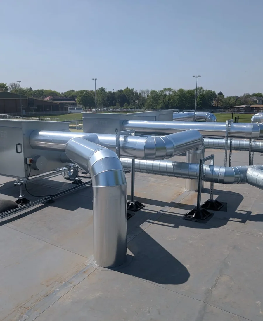 Weatherproof insulated services on an education building rooftop