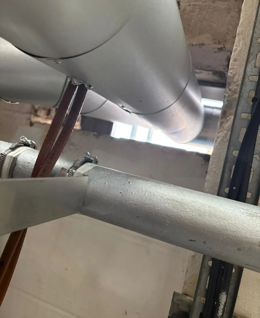 Hospital service insulation fitted around live plant and fittings