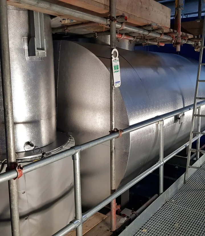 Aluminium-clad exhaust vessel installed for high-temperature duty