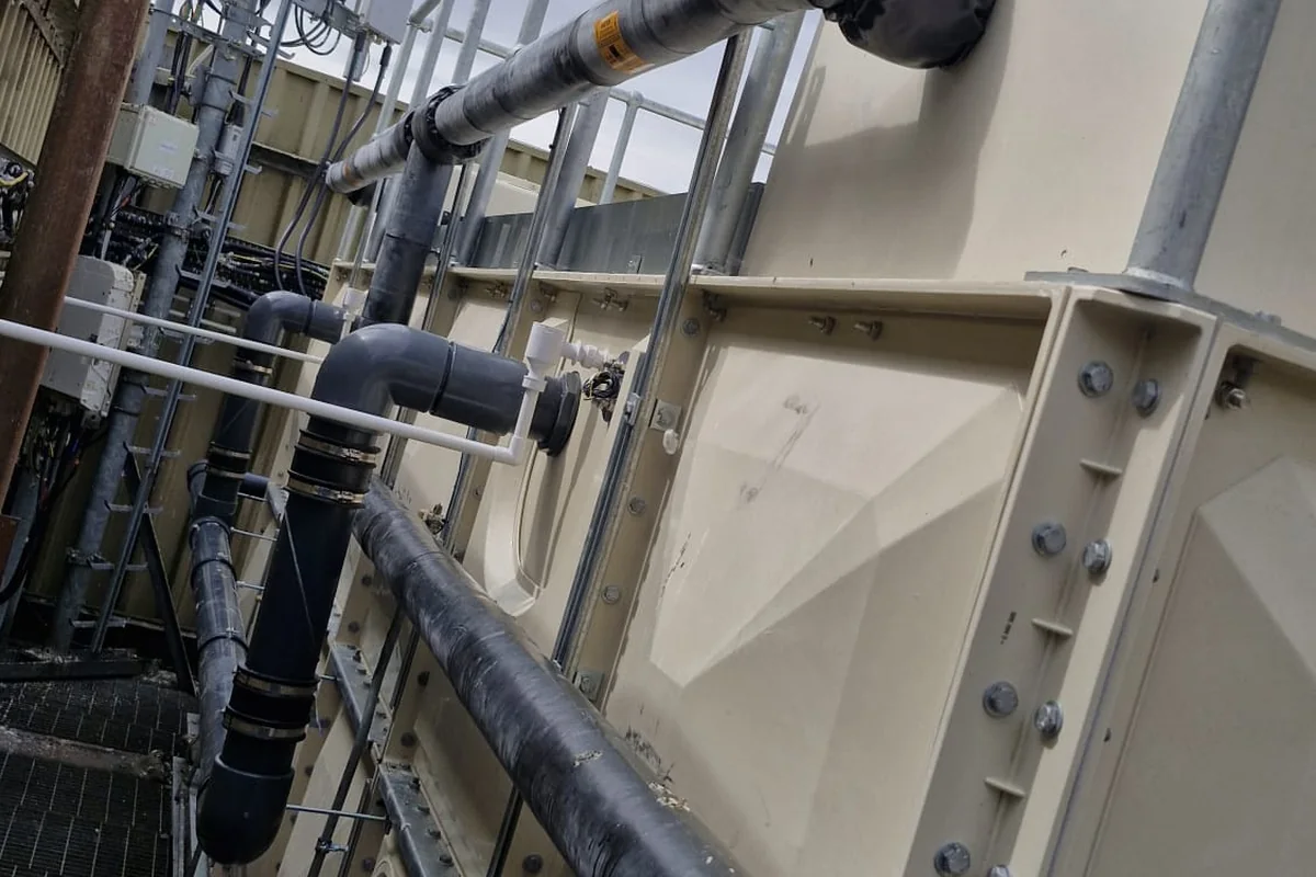 Hospital plant-room pipework showing insulation energy-saving opportunities