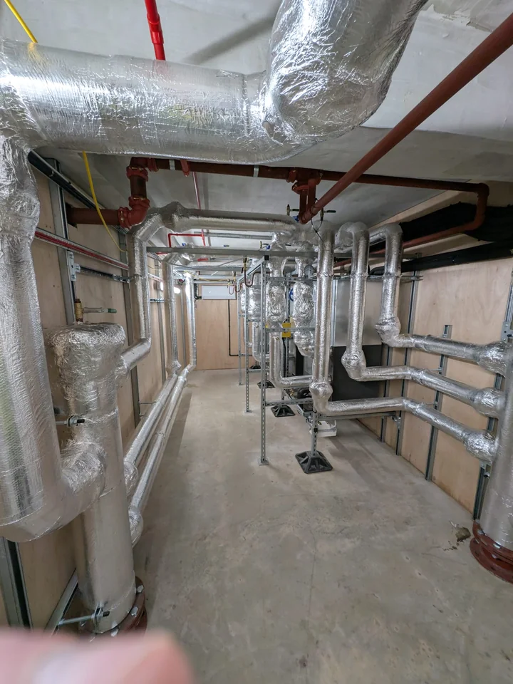 Commercial building plant room with insulated mechanical services