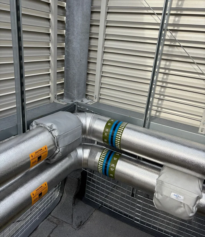 Trace-heated insulated pipework with directional identification and valve jacket