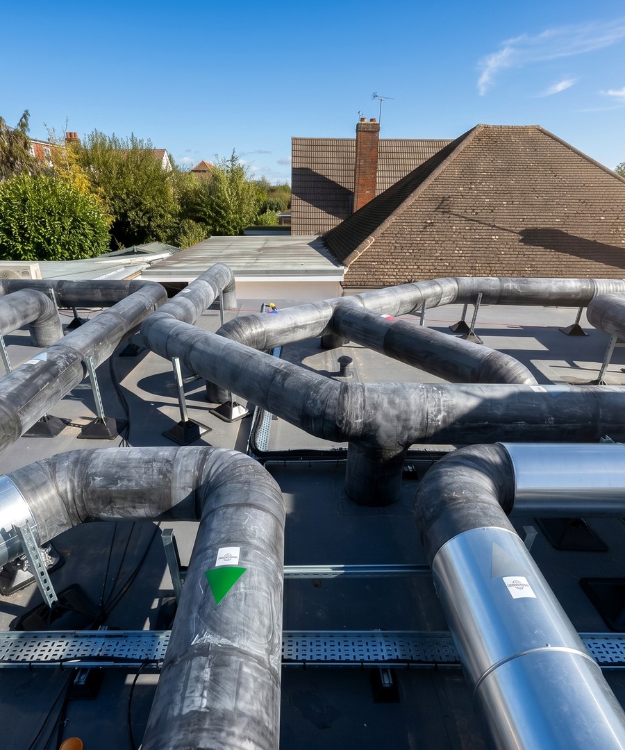 Close-up view of insulated industrial services with aluminium finish on the GIKN / GKN project