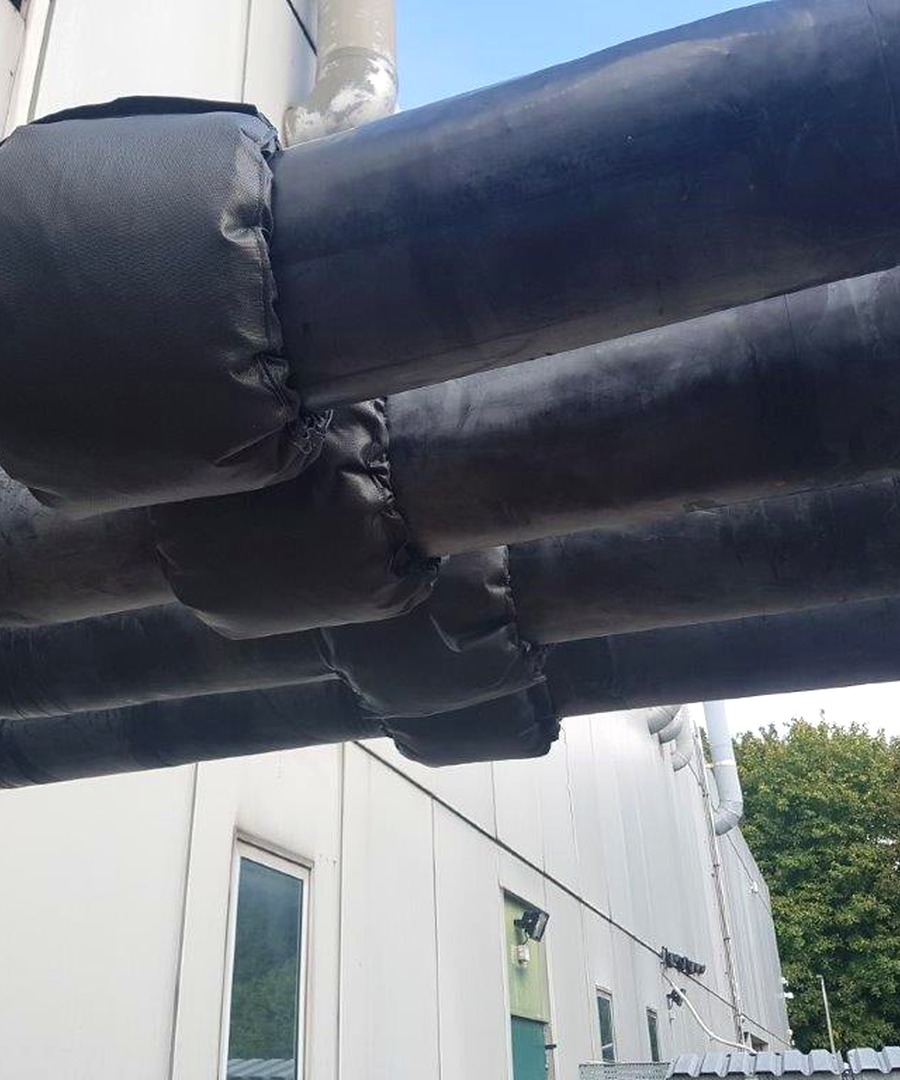 Insulated public-sector service pipework showing practical installation approach