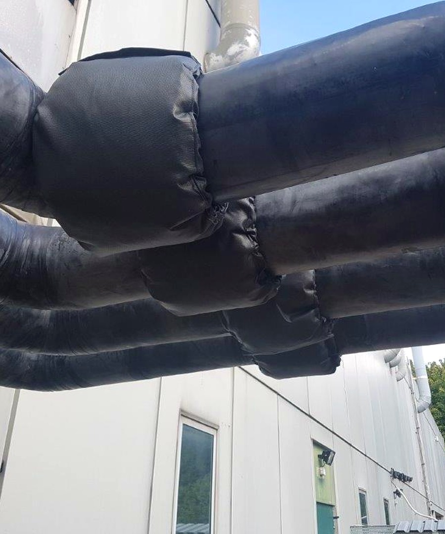 Close-up insulation jacket detail on external pipework for Suffolk County Council case study