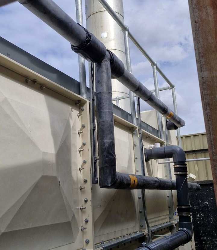 Hygienic insulation detail with wipe-clean finish around service routes