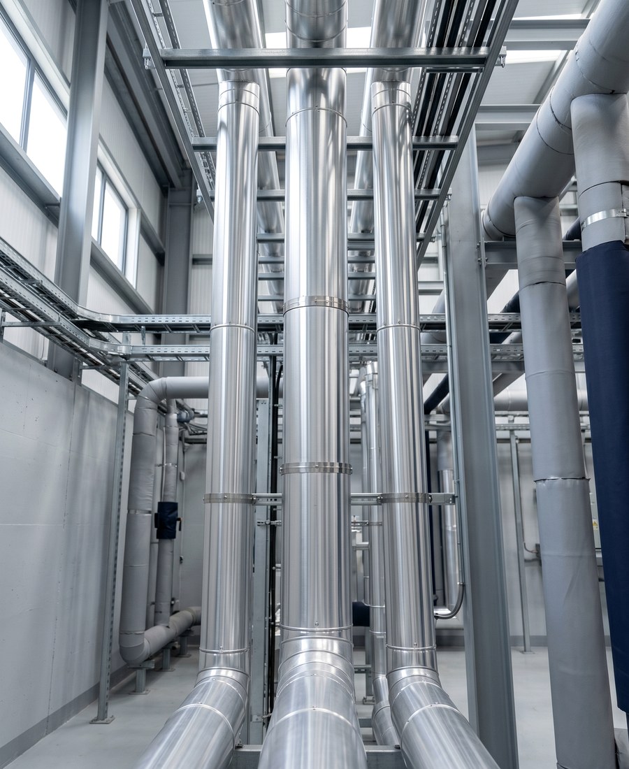 aluminium pipe cladding jackets and pipework inside a commercial plant room